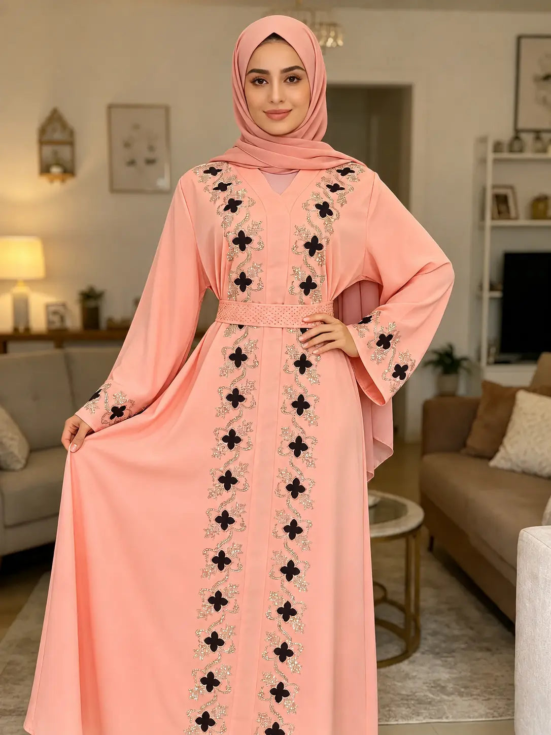 Abaya florale rose poudré brodée portée avec hijab