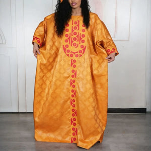 Robe djellaba africaine orange doré à broderies rouges