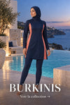 Femme portant un burkini bleu marine et corail au bord d’une piscine méditerranéenne